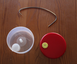 Disassembled parts of the For Hummingbirds Only spinning hummingbird feeder